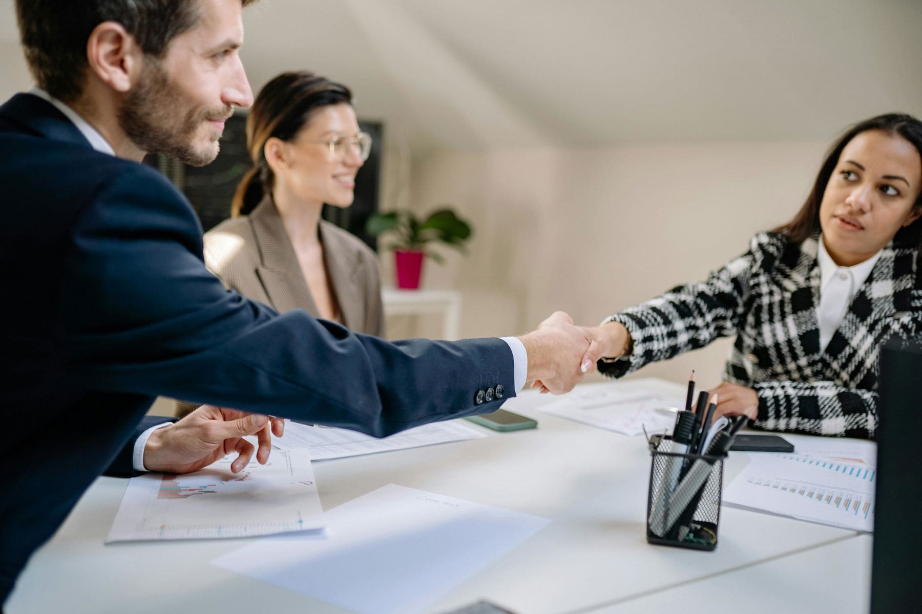 Two people shaking hands after a meeting