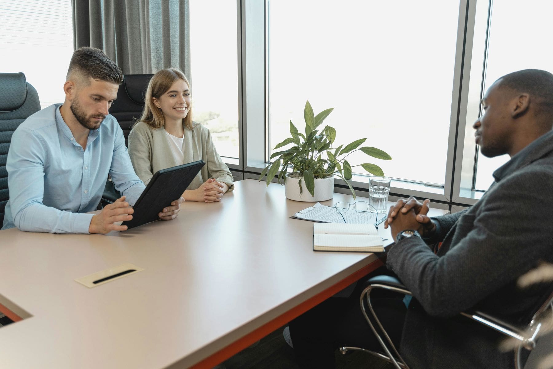 Two people interviewing a potential employee candidate