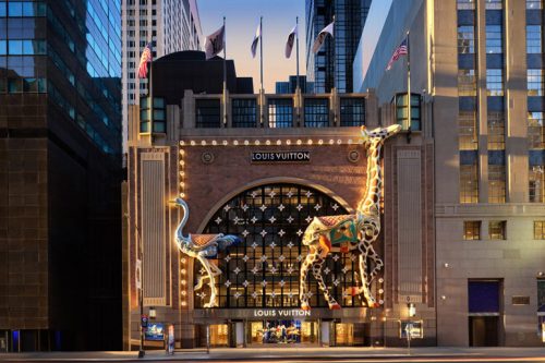 Louis Vuitton store with gold facade and giraffe motif