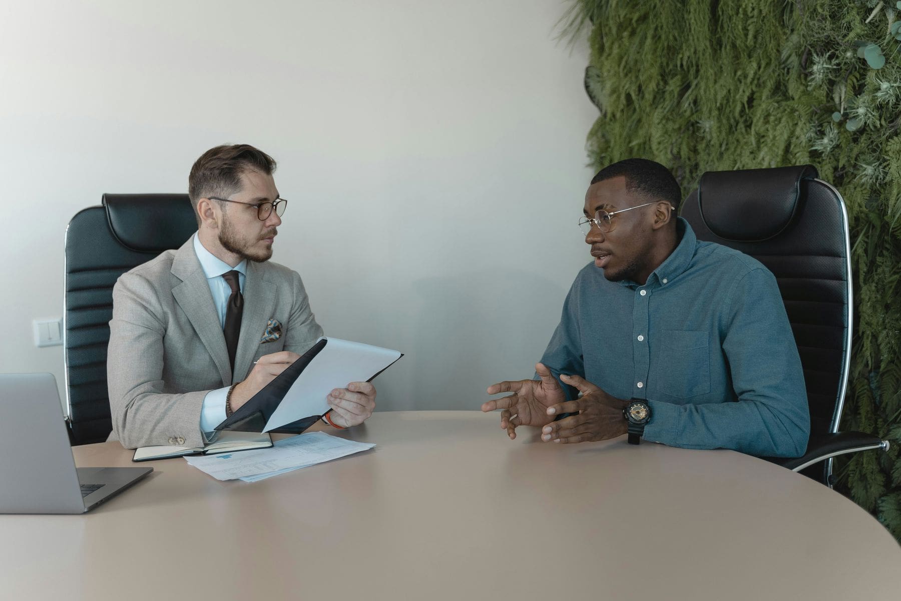 Man explaining his answer during a job interview session