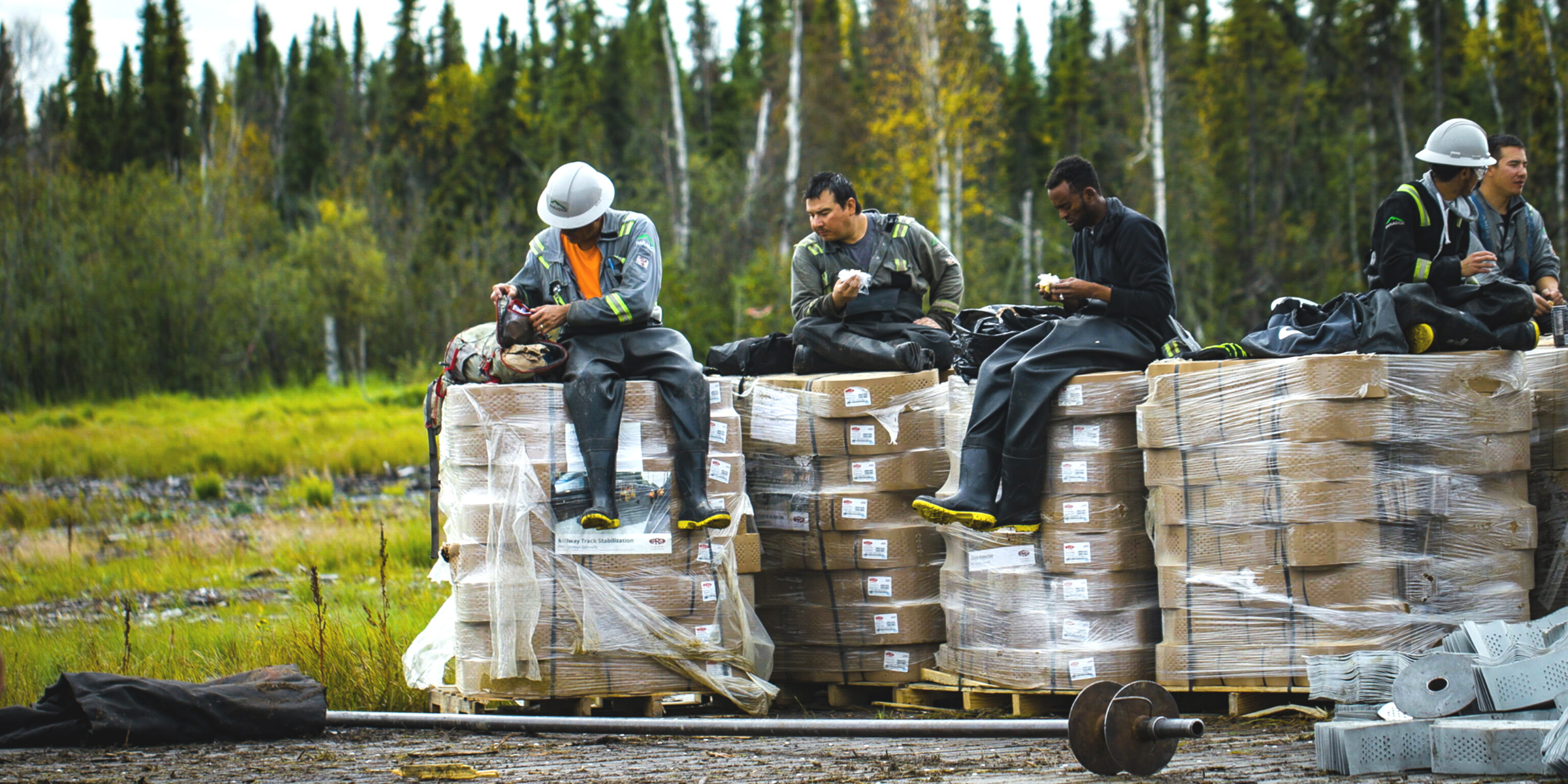 Employees on a construction site enjoying lunch break.