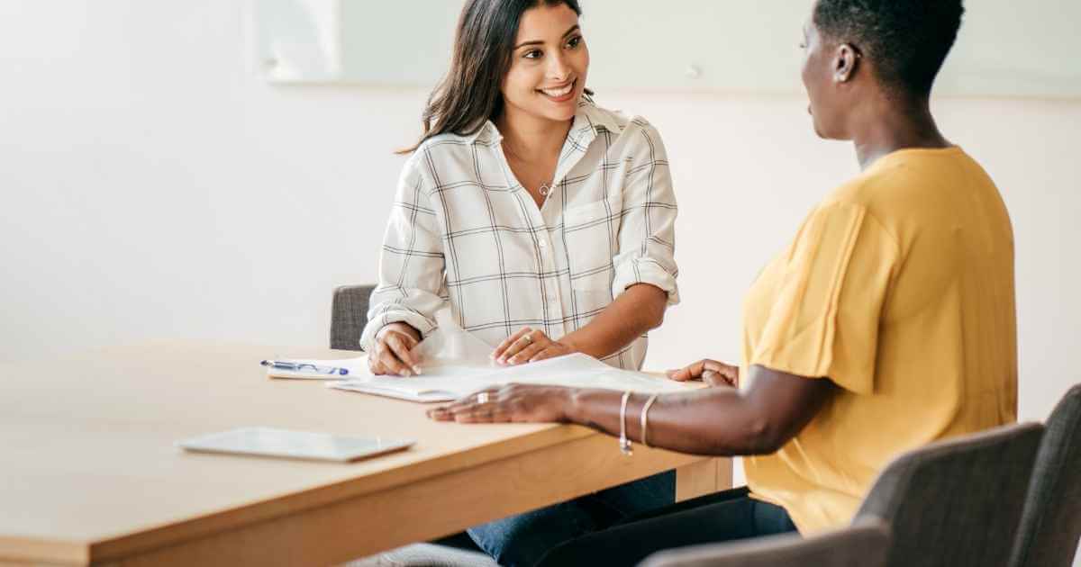 Woman looking at a job applicant during a job interview