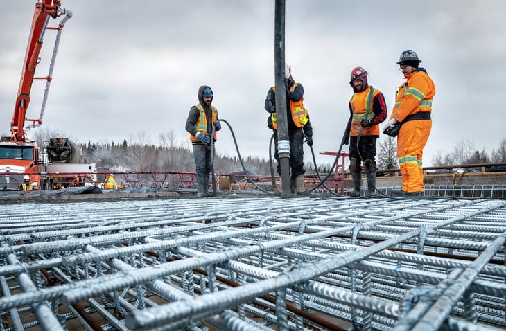 Concreting a bridge slab using a concrete pump during winter